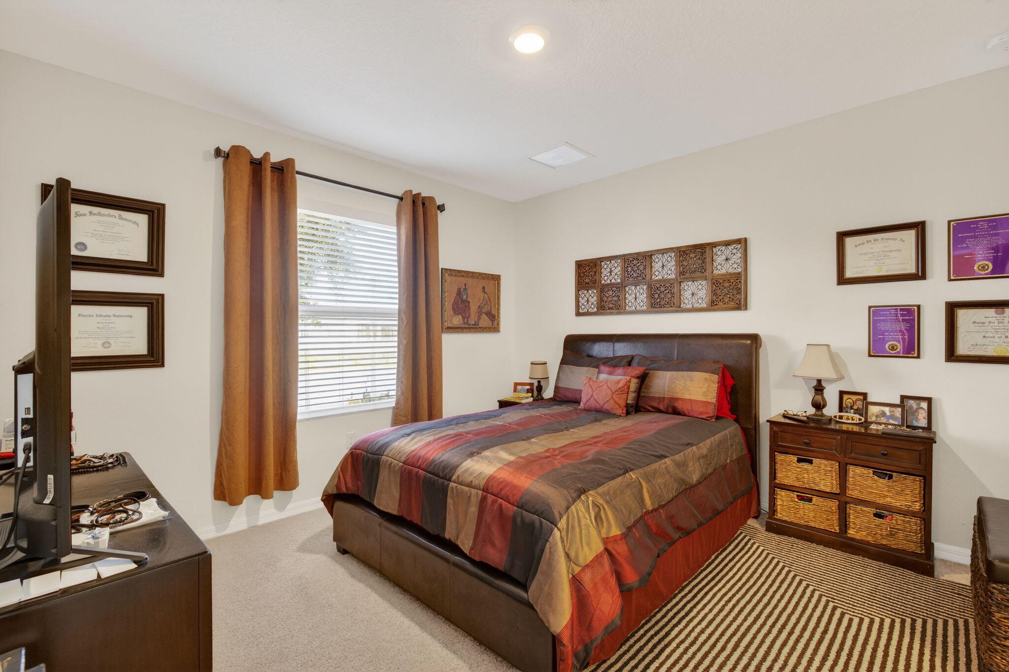 5221 Armina Place Fort Pierce, FL 34951 - Photo 15 of 40 a bedroom with a bed and dresser next to a window