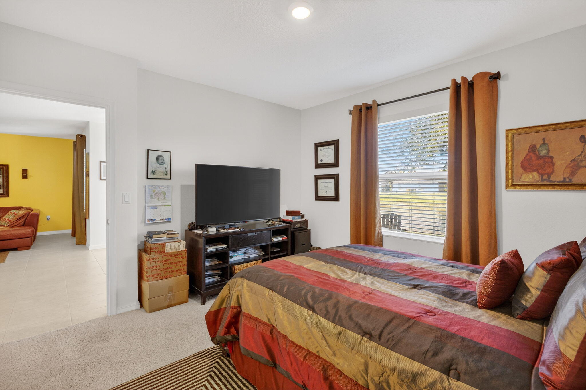 5221 Armina Place Fort Pierce, FL 34951 - Photo 17 of 40 a bedroom with a bed and a flat screen tv
