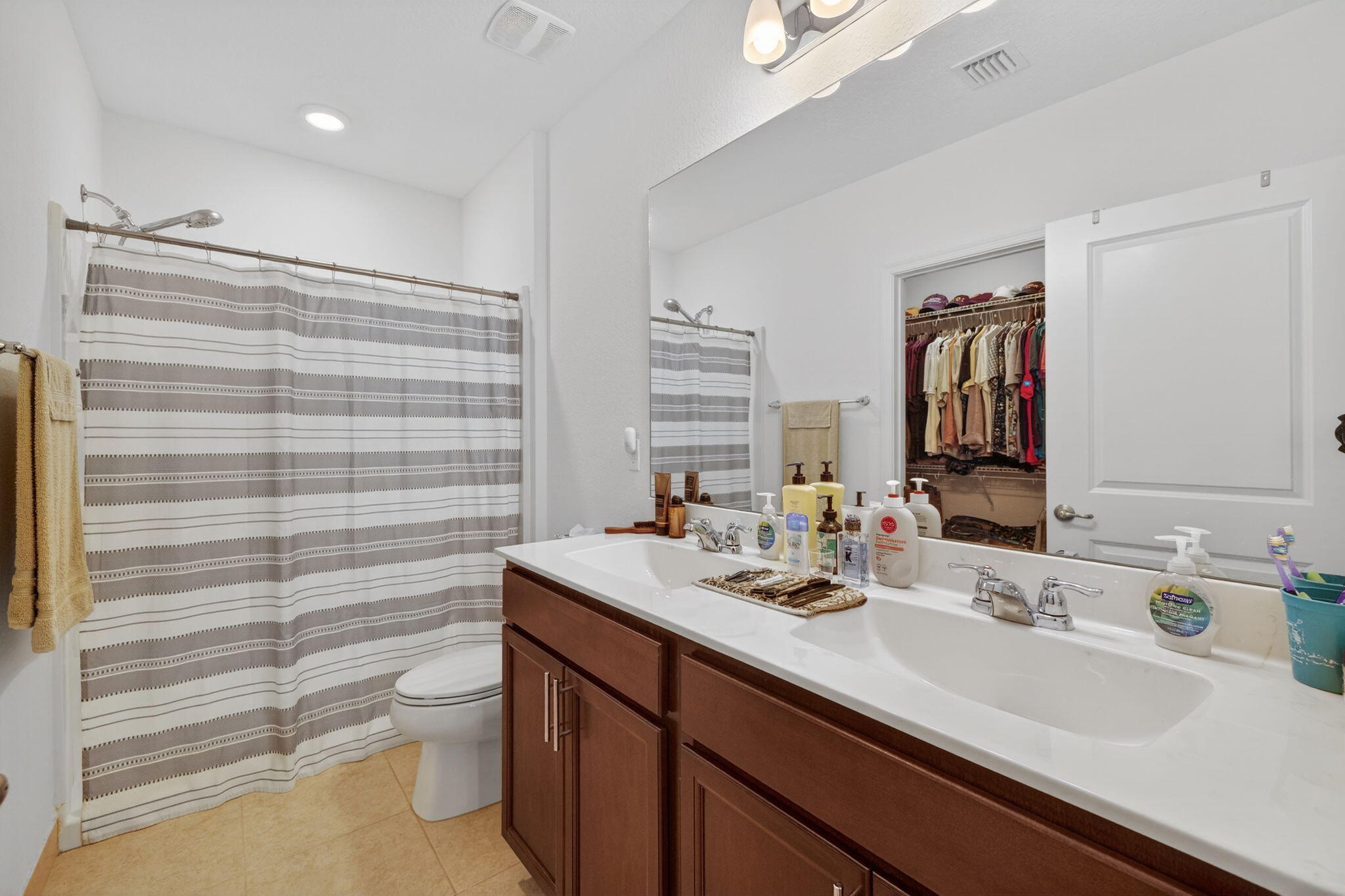 5221 Armina Place Fort Pierce, FL 34951 - Photo 18 of 40 a bathroom with a sink a toilet and shower