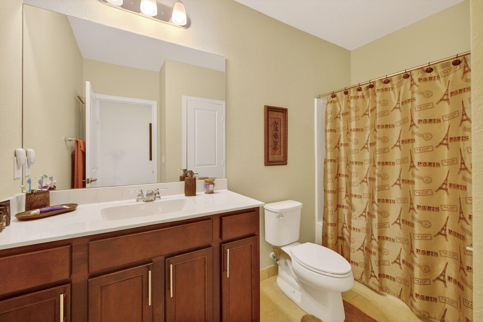 5221 Armina Place Fort Pierce, FL 34951 - Photo 20 of 40 a bathroom with a double vanity sink toilet and shower