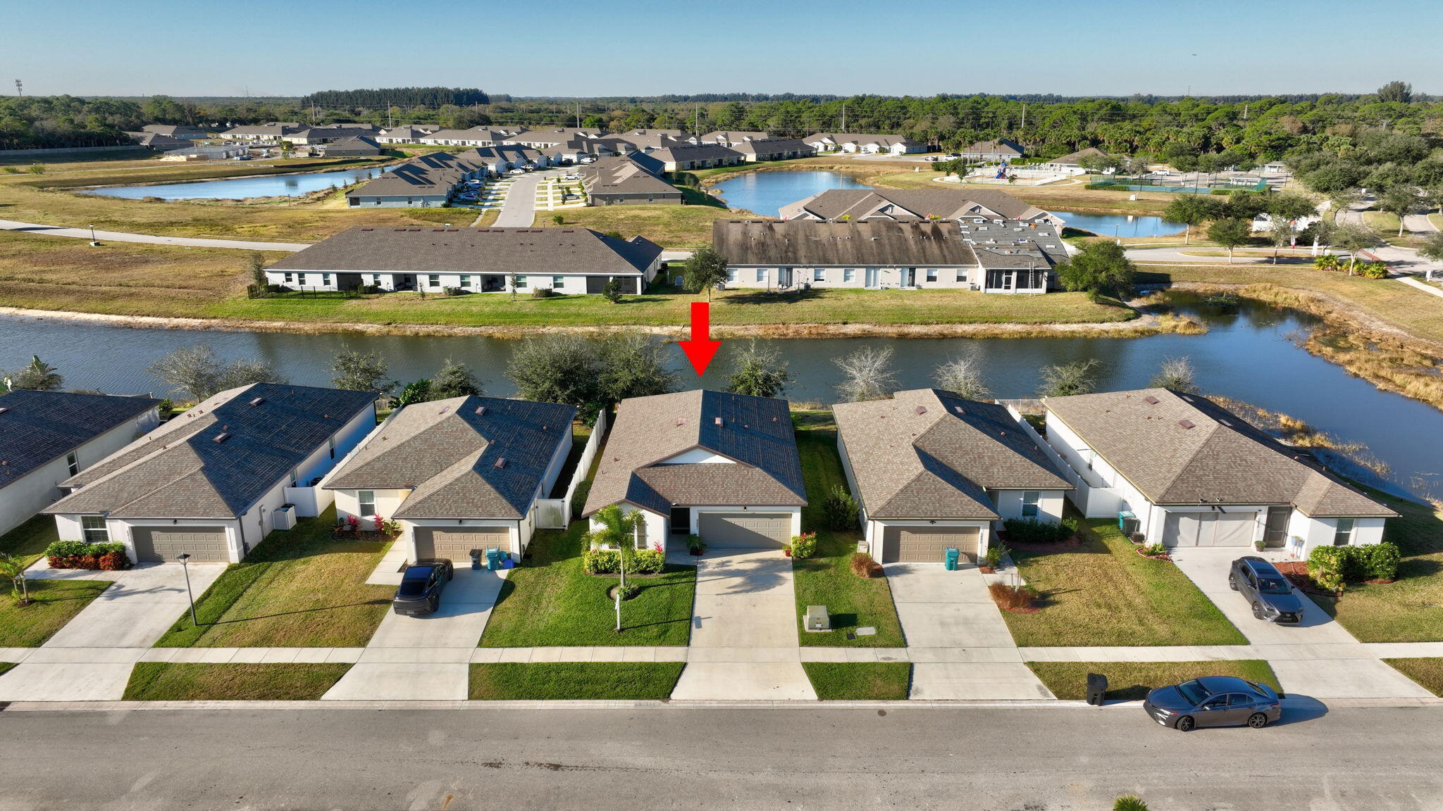 5221 Armina Place Fort Pierce, FL 34951 - Photo 2 of 40 an aerial view of residential houses with outdoor space