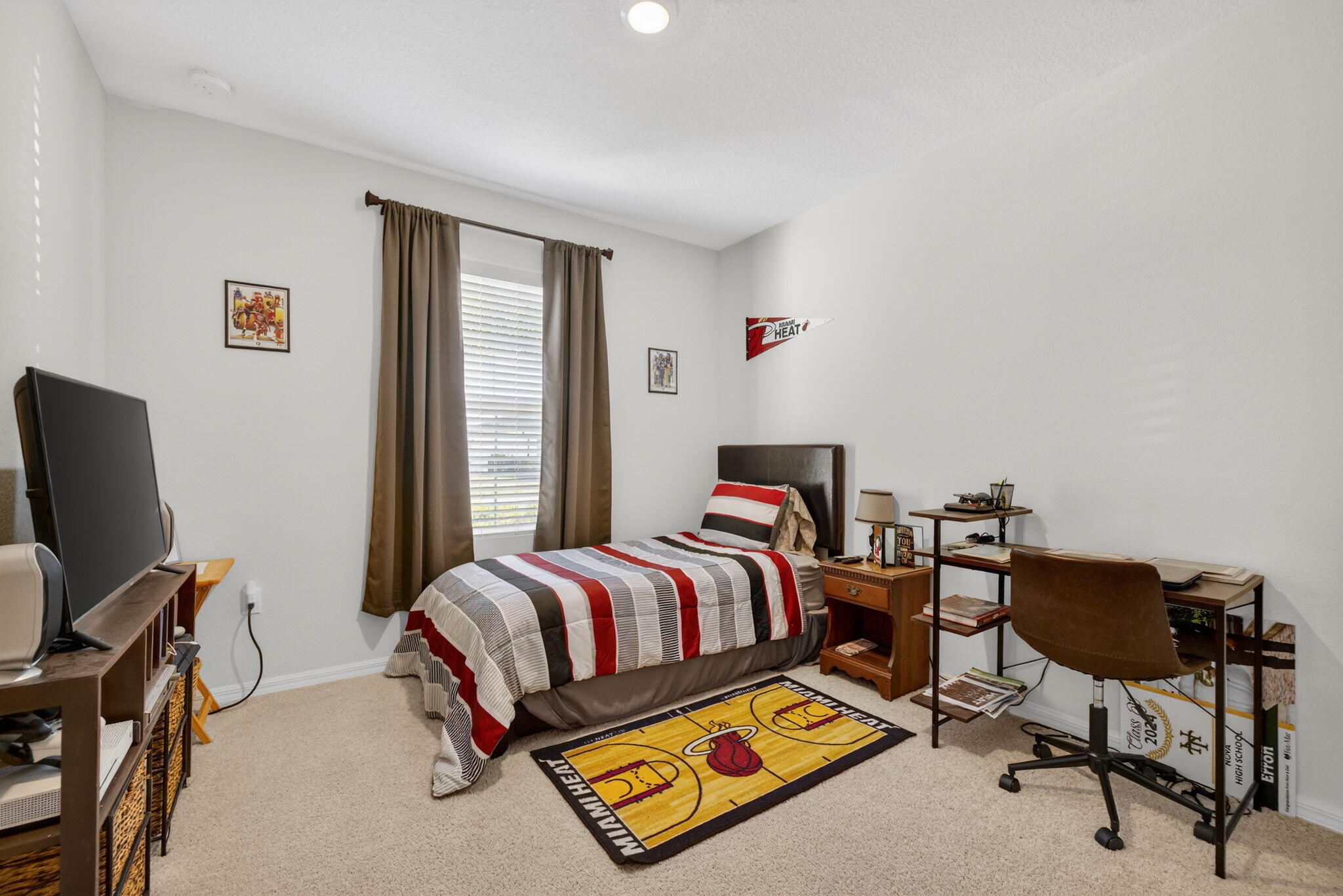 5221 Armina Place Fort Pierce, FL 34951 - Photo 21 of 40 a bed room with a bed and a chair