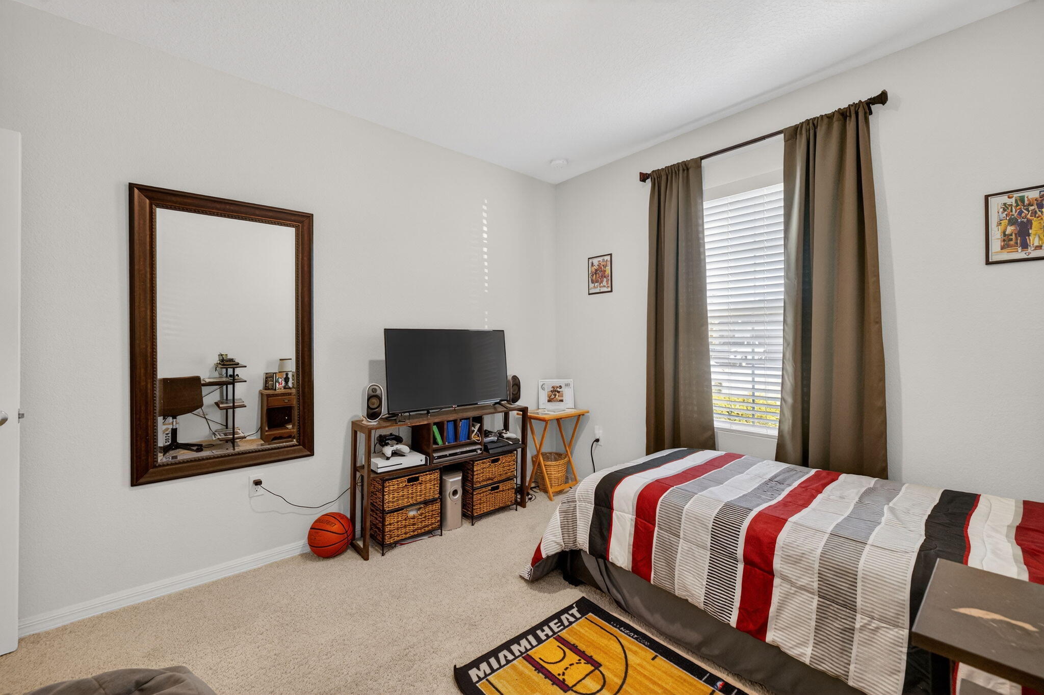 5221 Armina Place Fort Pierce, FL 34951 - Photo 22 of 40 a bedroom with a bed and a flat tv screen on a dresser