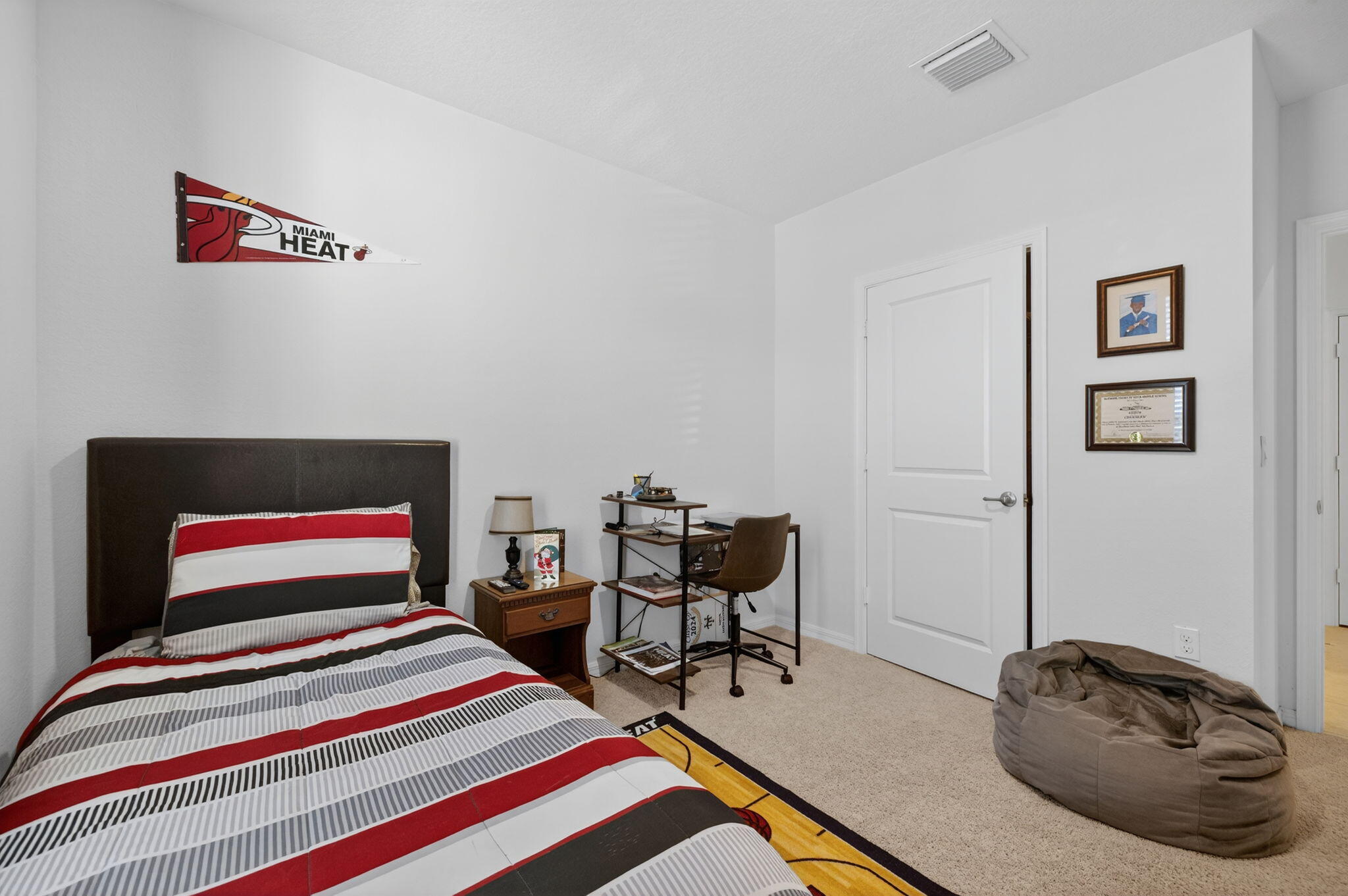 5221 Armina Place Fort Pierce, FL 34951 - Photo 23 of 40 a bedroom with a bed and a chair