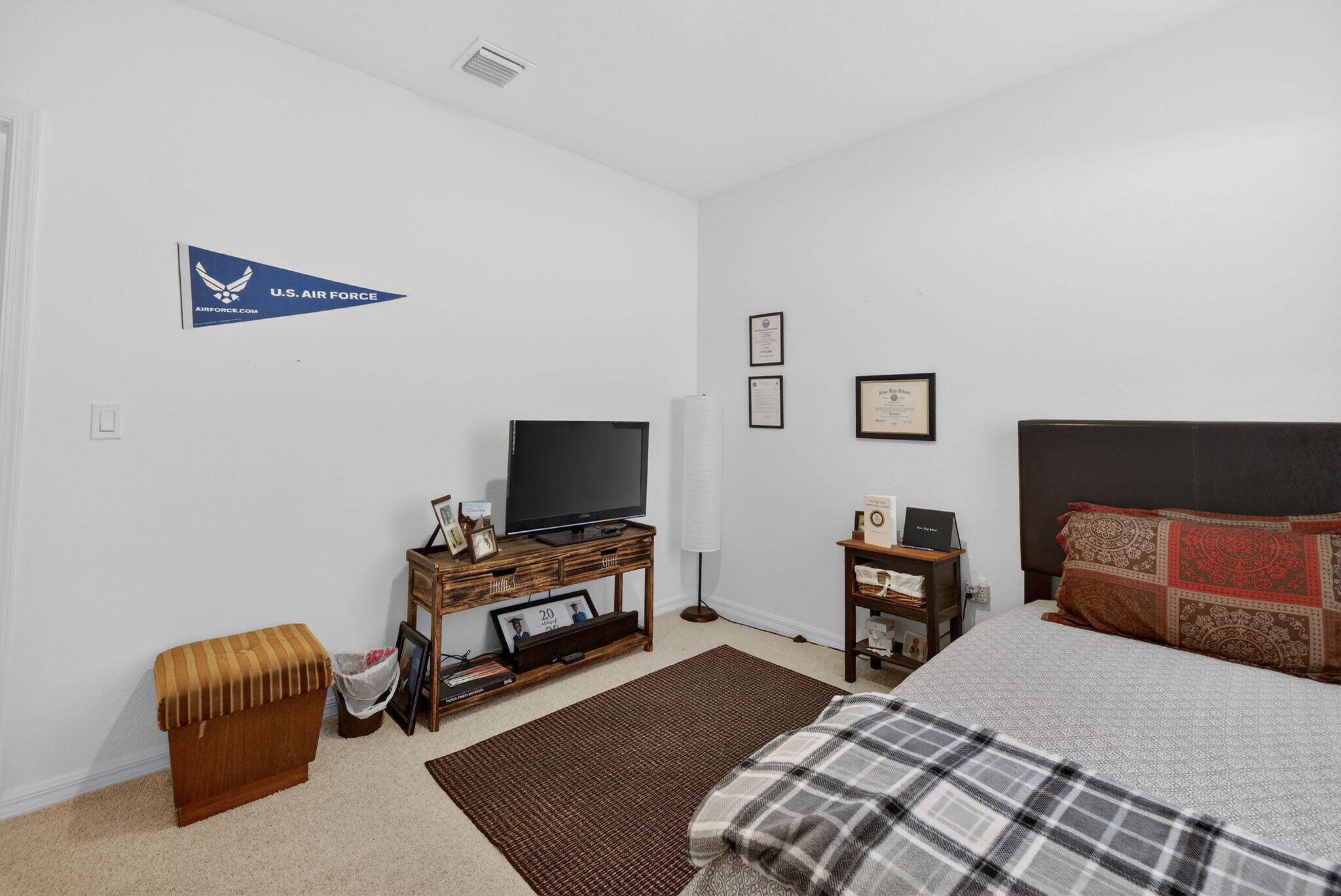 5221 Armina Place Fort Pierce, FL 34951 - Photo 24 of 40 a bedroom with furniture and a flat screen tv