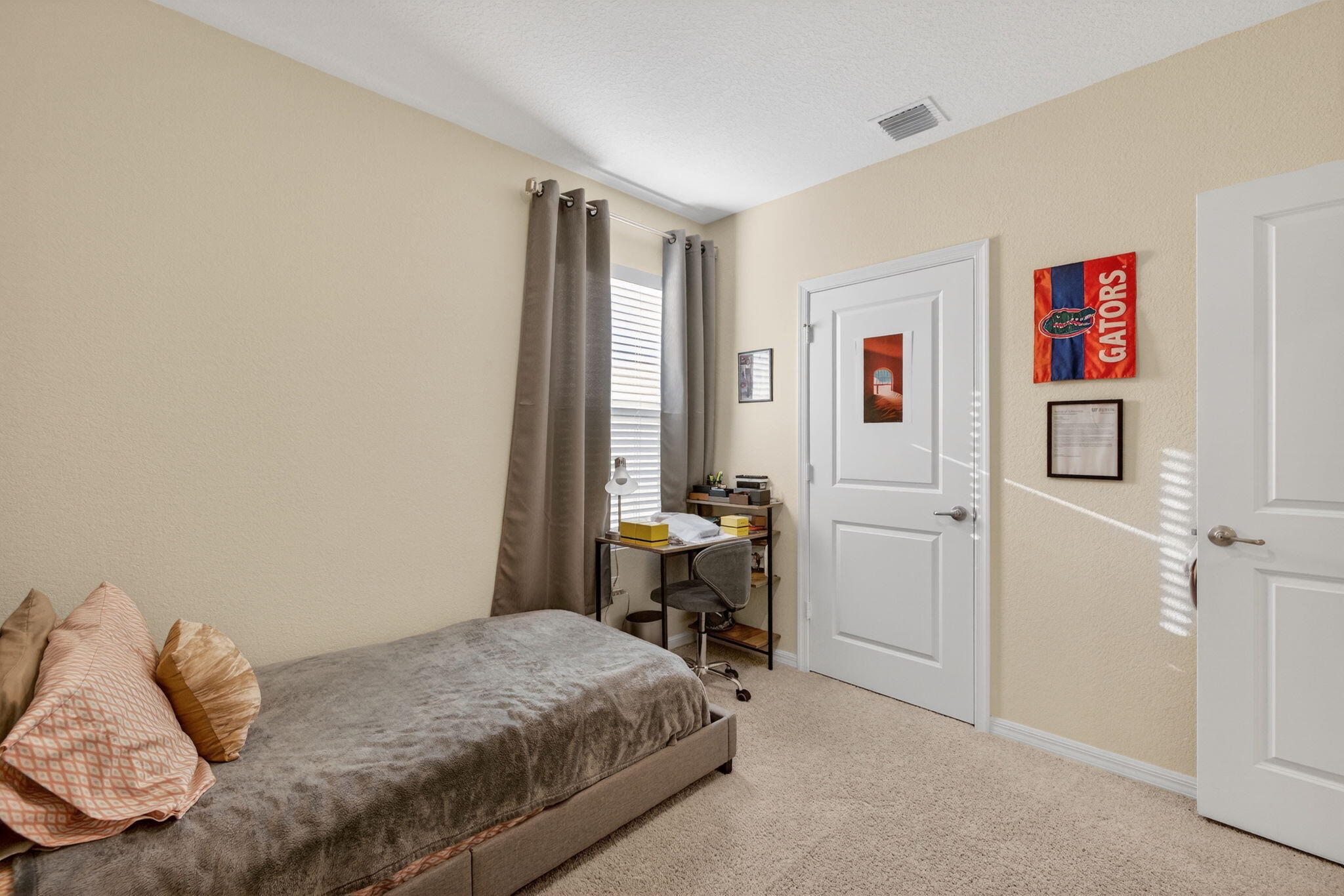 5221 Armina Place Fort Pierce, FL 34951 - Photo 26 of 40 a bedroom with a bed and a window