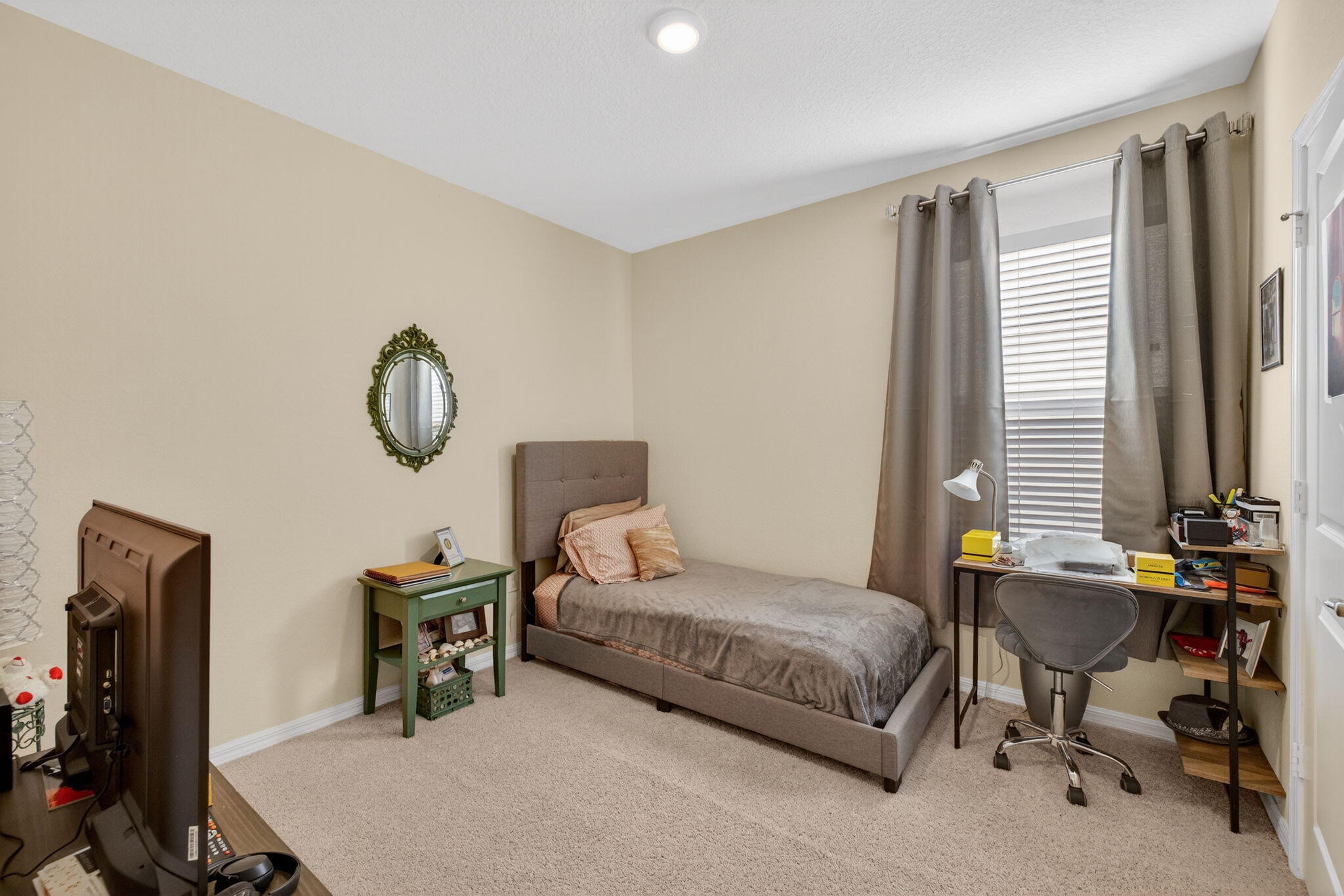 5221 Armina Place Fort Pierce, FL 34951 - Photo 27 of 40 a living room with furniture a window and a flat screen tv