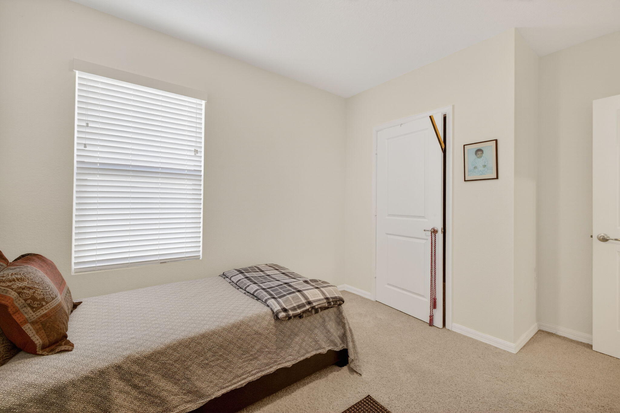 5221 Armina Place Fort Pierce, FL 34951 - Photo 28 of 40 a bedroom with a bed and a window