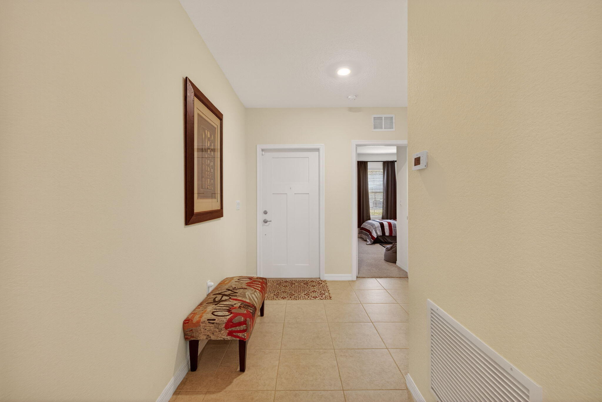 5221 Armina Place Fort Pierce, FL 34951 - Photo 3 of 40 a hallway with sliding door and stairs