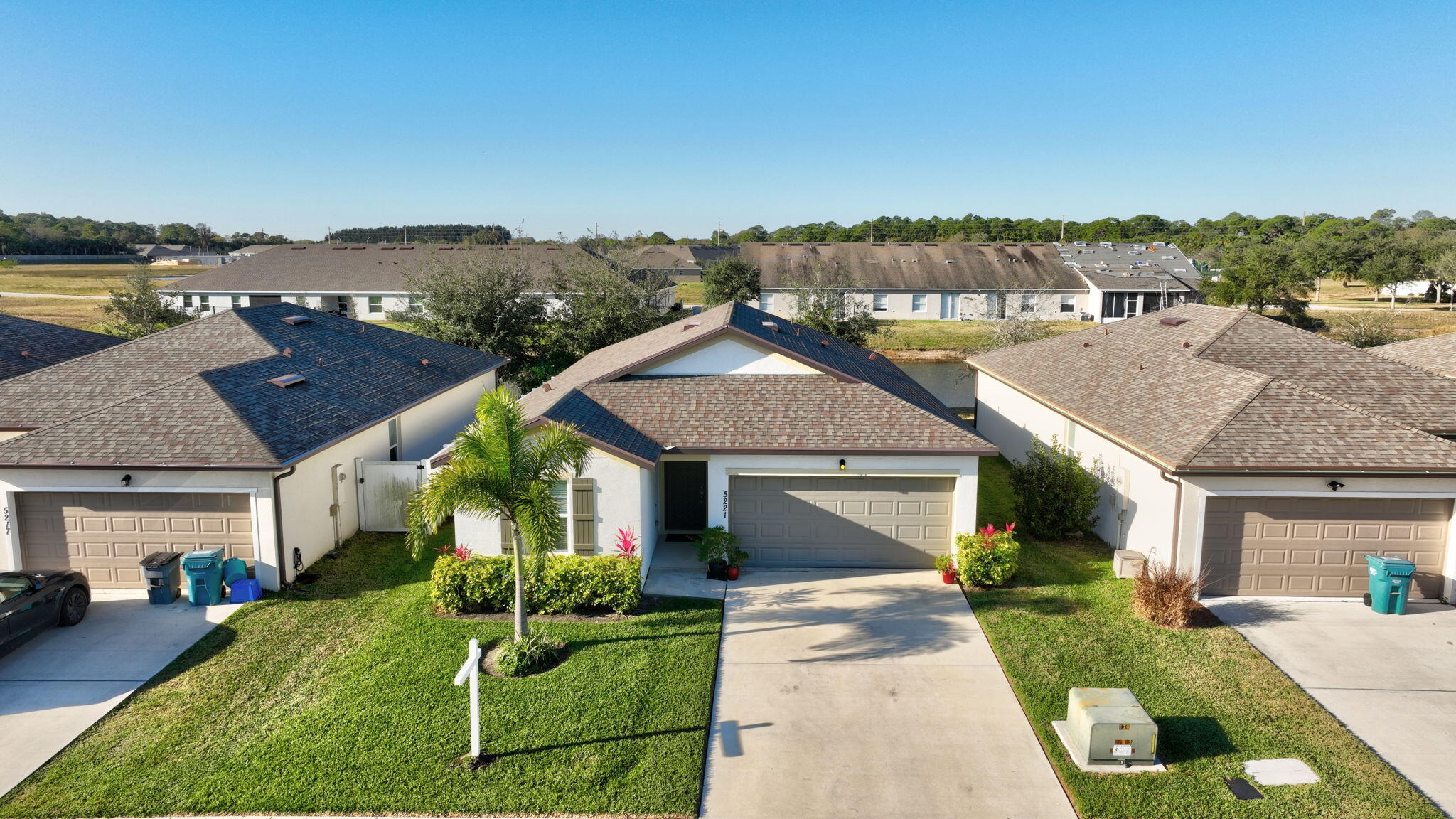 5221 Armina Place Fort Pierce, FL 34951 - Photo 32 of 40 a aerial view of a house with a yard table and chairs