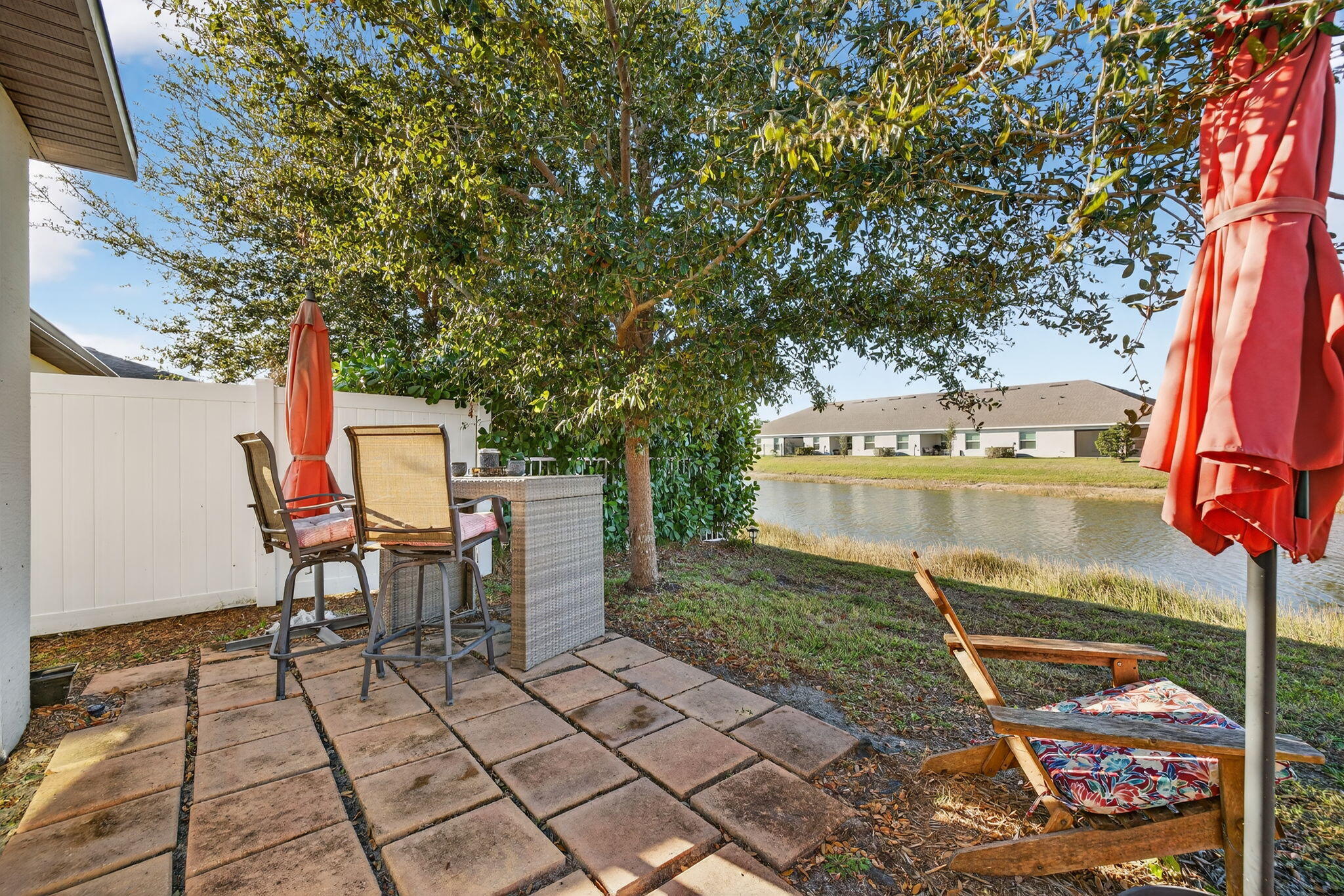 5221 Armina Place Fort Pierce, FL 34951 - Photo 35 of 40 a backyard of a house with table and chairs