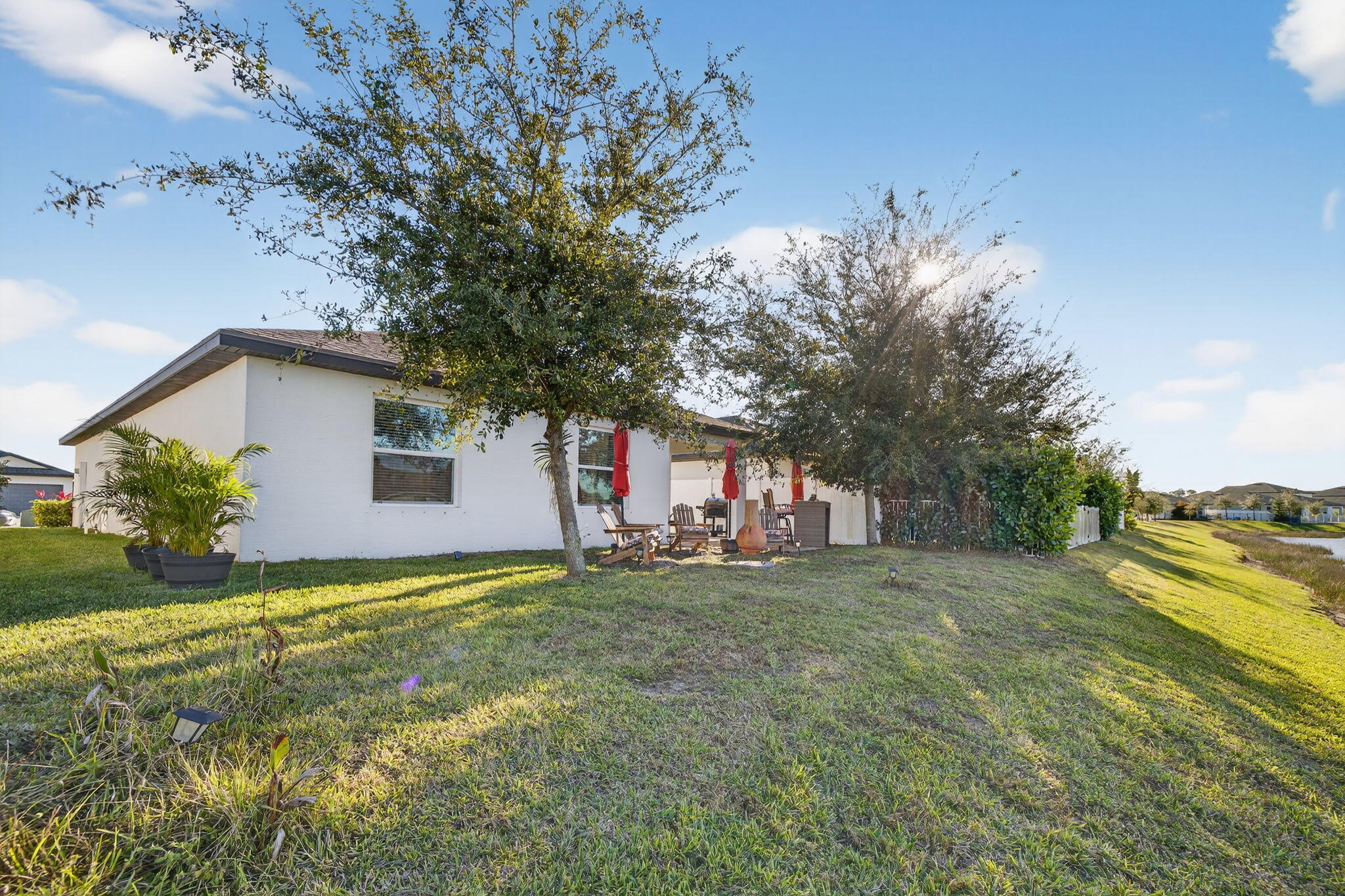 5221 Armina Place Fort Pierce, FL 34951 - Photo 37 of 40 a view of a house with a yard and garage