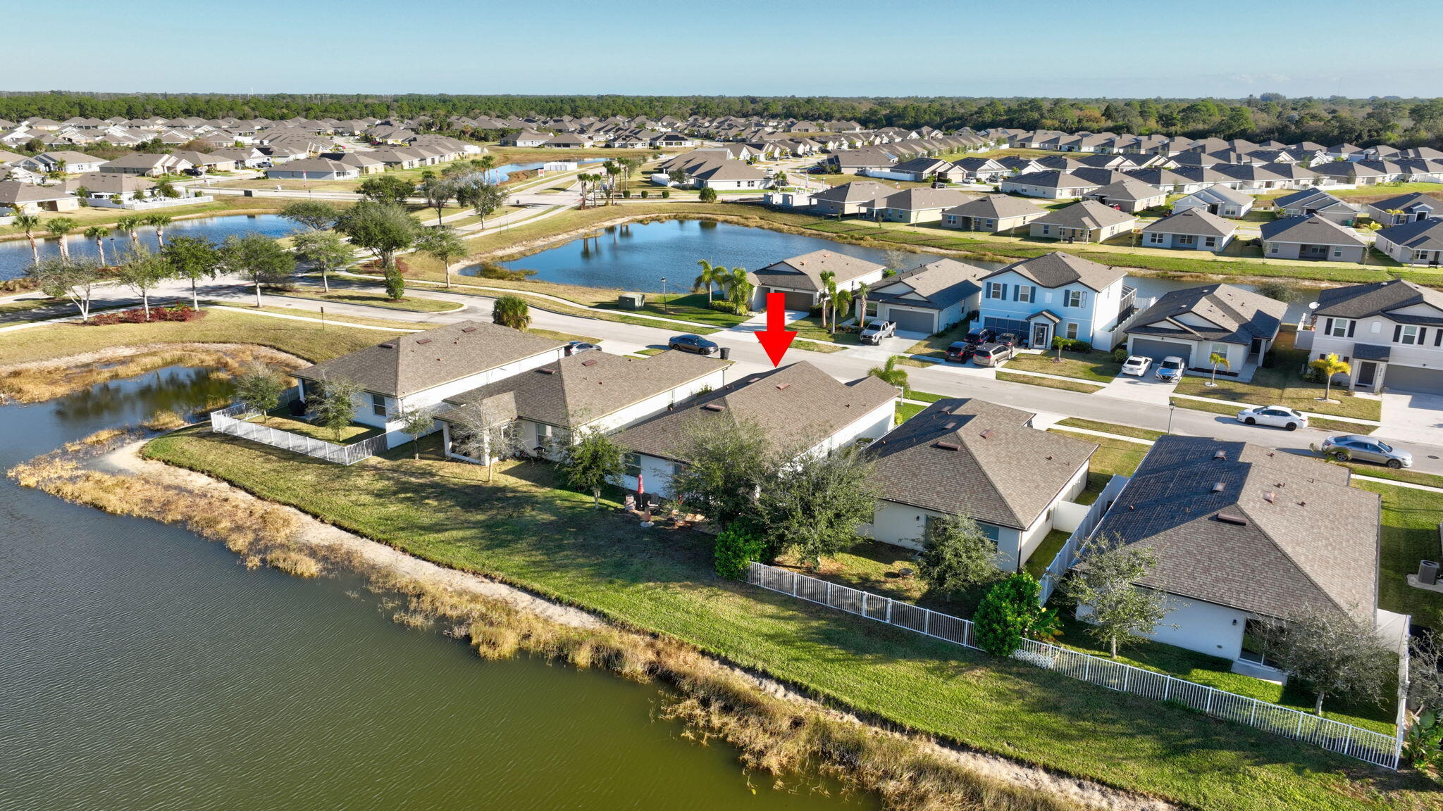 5221 Armina Place Fort Pierce, FL 34951 - Photo 38 of 40 an aerial view of residential houses with outdoor space