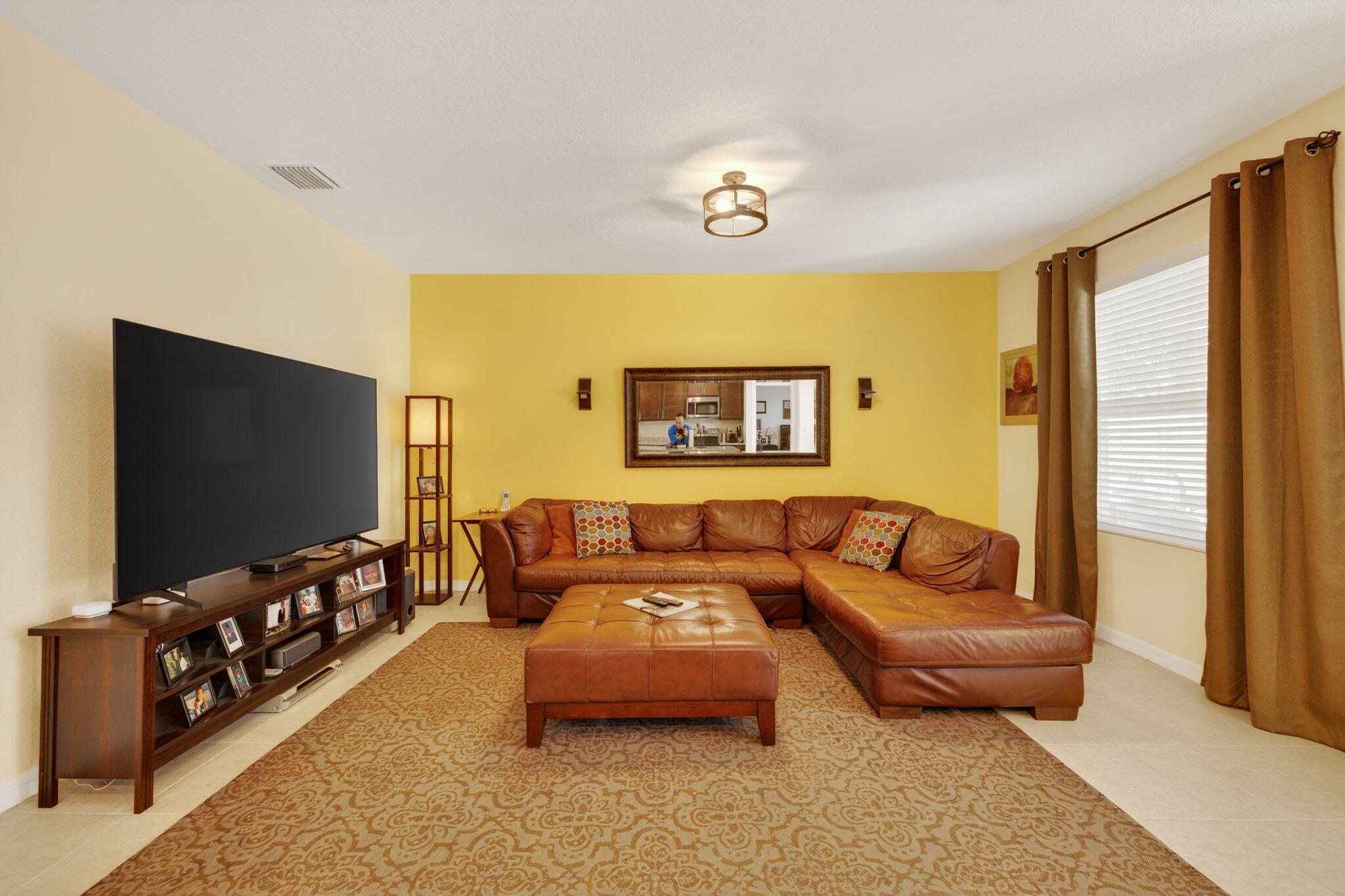 5221 Armina Place Fort Pierce, FL 34951 - Photo 4 of 40 a living room with furniture and a flat screen tv