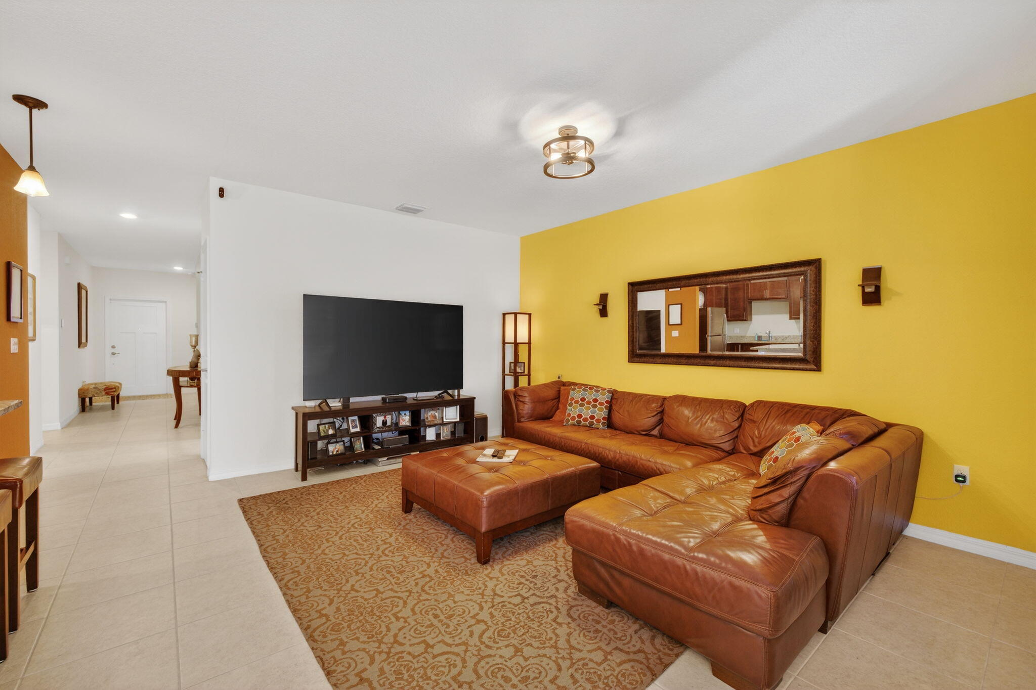 5221 Armina Place Fort Pierce, FL 34951 - Photo 5 of 40 a living room with furniture and a flat screen tv