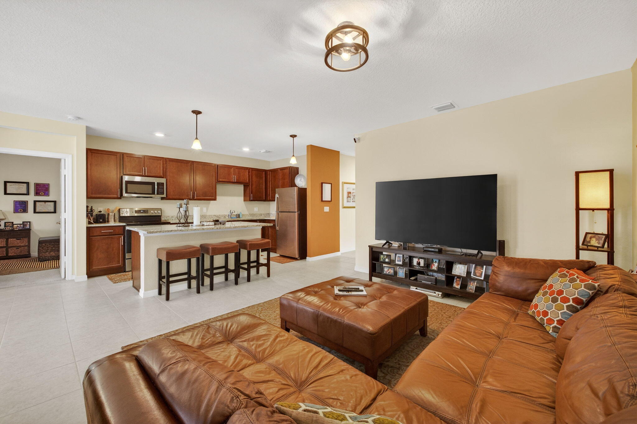 5221 Armina Place Fort Pierce, FL 34951 - Photo 7 of 40 a living room with furniture and a flat screen tv