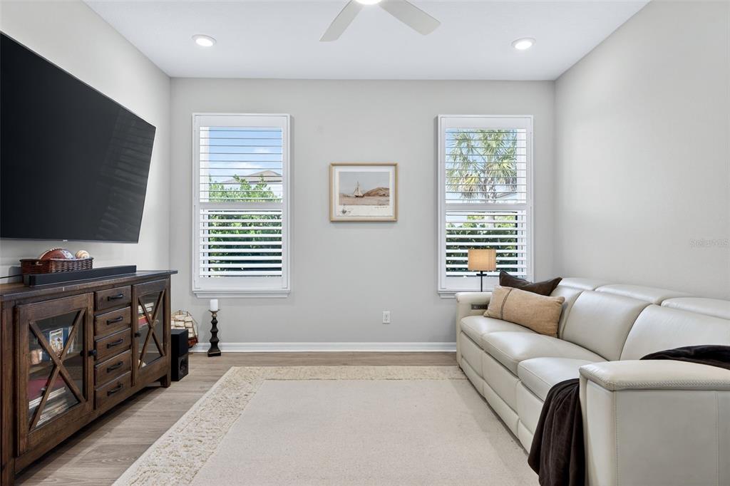 16106 Culpepper Drive Lakewood Ranch, FL 34211 - Photo 20 of 99 a living room with furniture and a flat screen tv