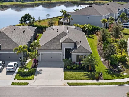 an aerial view of a house with a yard and a garden