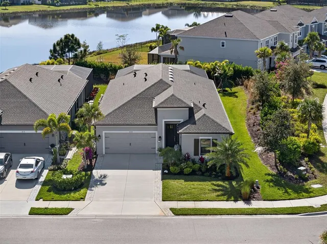 an aerial view of a house with a yard and a garden