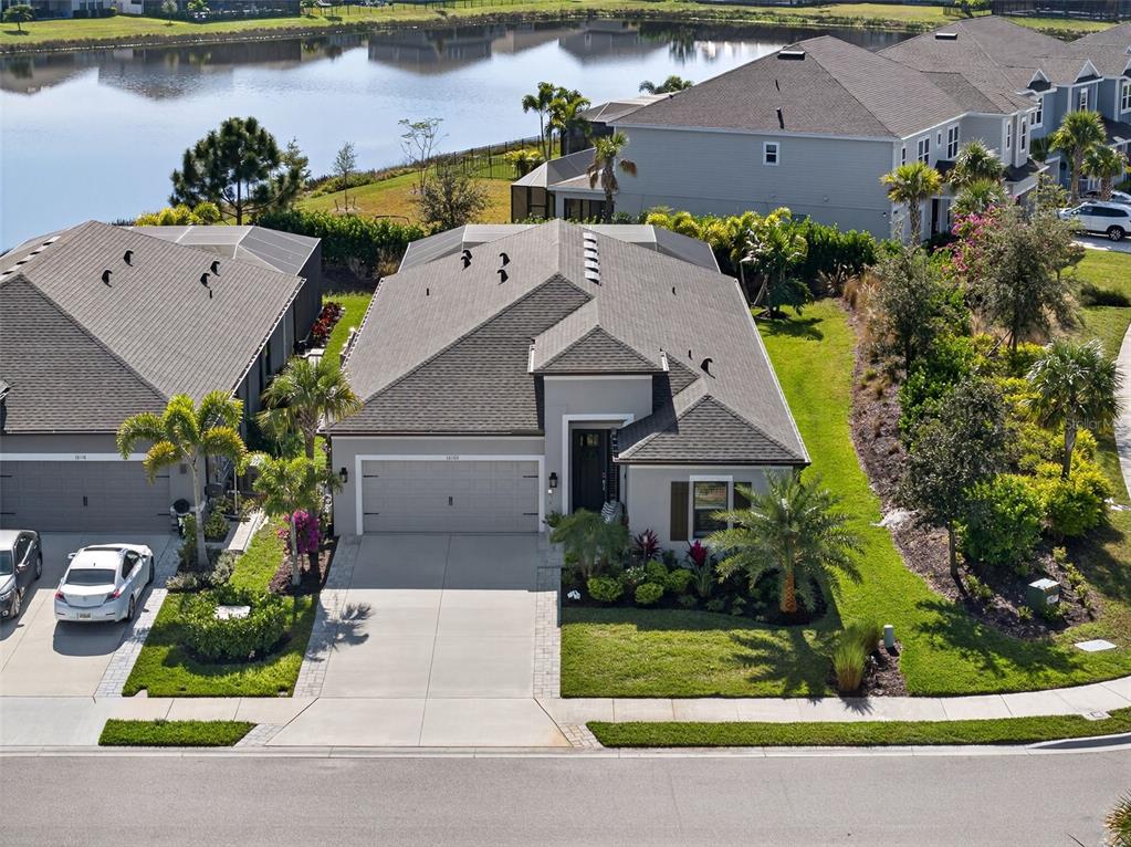 16106 Culpepper Drive Lakewood Ranch, FL 34211 - Photo 2 of 99 an aerial view of a house with a yard and a garden