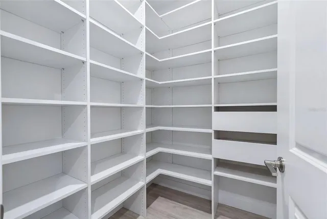 a bedroom with furniture and flat screen tv