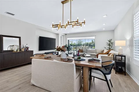 a bed room with a bed and a painting on the wall