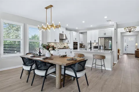 a bathroom with a sink a mirror and a toilet