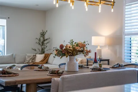 a view of walk in closet with clothes