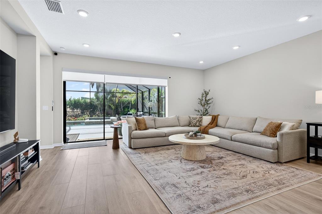 16106 Culpepper Drive Lakewood Ranch, FL 34211 - Photo 44 of 99 a living room with furniture and a flat screen tv