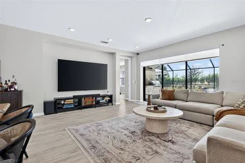 a bedroom with bed and a chandelier