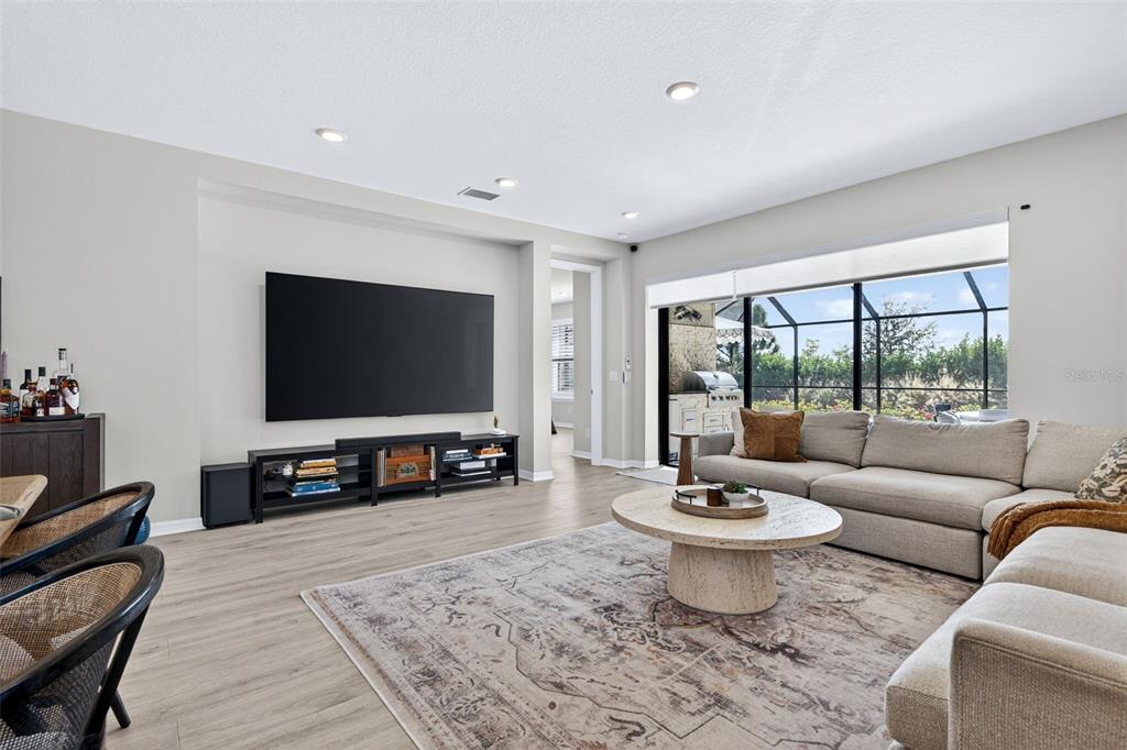 16106 Culpepper Drive Lakewood Ranch, FL 34211 - Photo 45 of 99 a living room with furniture and a flat screen tv
