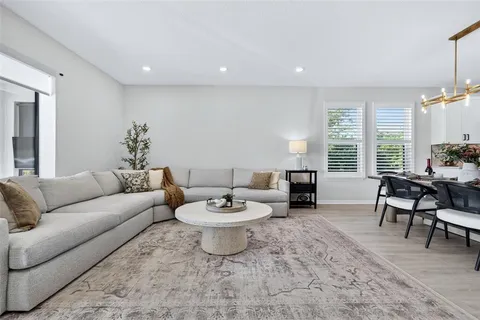 a bedroom with a bed and a mirror