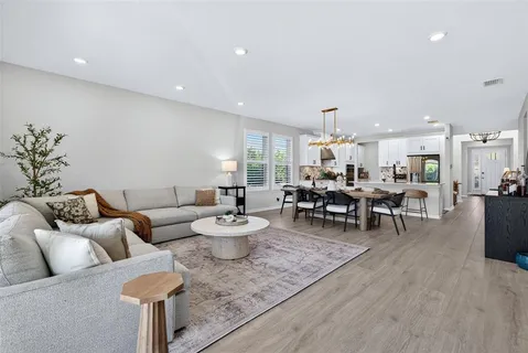 an aerial view of a house with a yard and potted plants