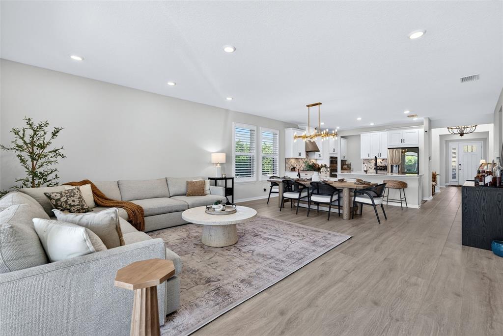 16106 Culpepper Drive Lakewood Ranch, FL 34211 - Photo 47 of 99 a living room with furniture and wooden floor
