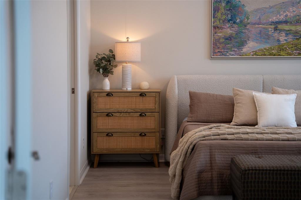 16106 Culpepper Drive Lakewood Ranch, FL 34211 - Photo 68 of 99 a bed room with a bed and a painting on the wall