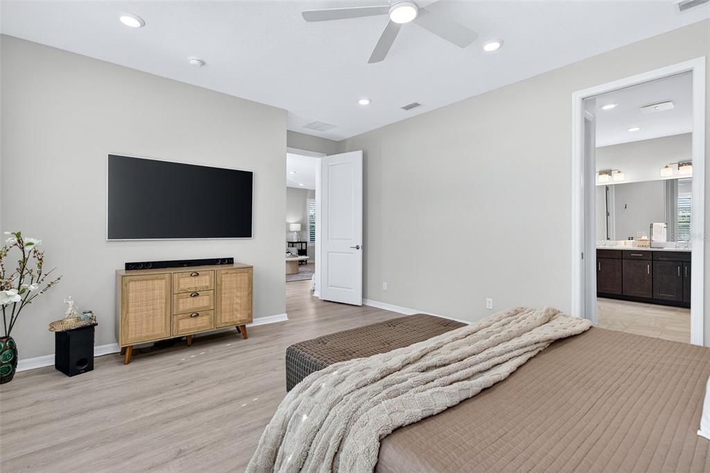 16106 Culpepper Drive Lakewood Ranch, FL 34211 - Photo 71 of 99 a bedroom with furniture and flat screen tv