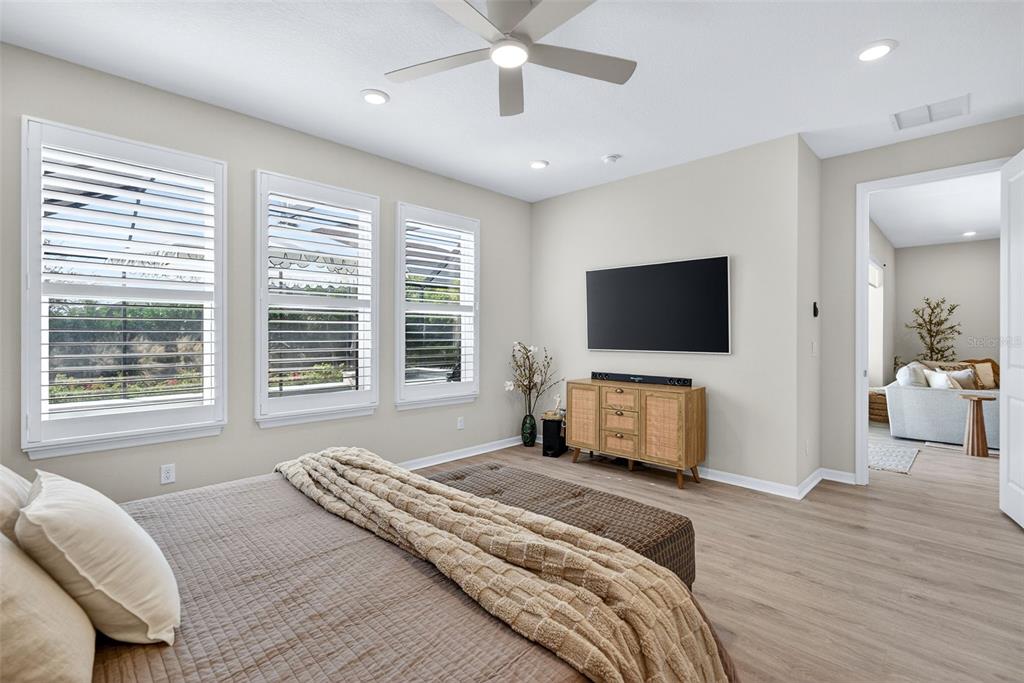 16106 Culpepper Drive Lakewood Ranch, FL 34211 - Photo 75 of 99 a bedroom with bed tv and window