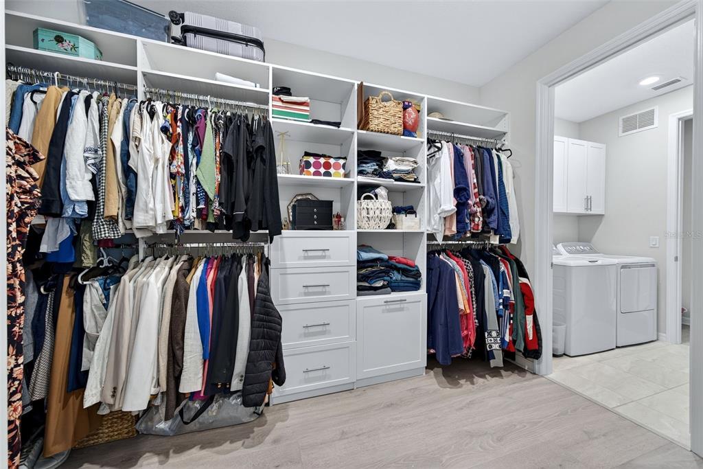 16106 Culpepper Drive Lakewood Ranch, FL 34211 - Photo 82 of 99 a view of walk in closet with clothes