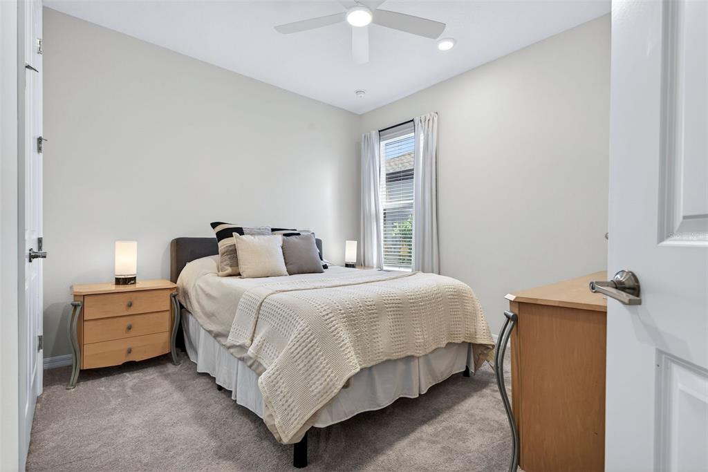 16106 Culpepper Drive Lakewood Ranch, FL 34211 - Photo 87 of 99 a bedroom with bed and a chandelier