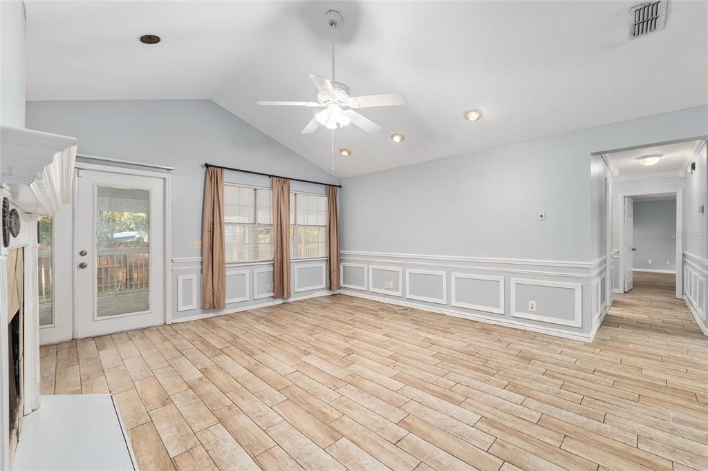 9161 Southwest 34th Place Ocala, FL 34481 - Photo 13 of 100 a view of an empty room with wooden floor and a window