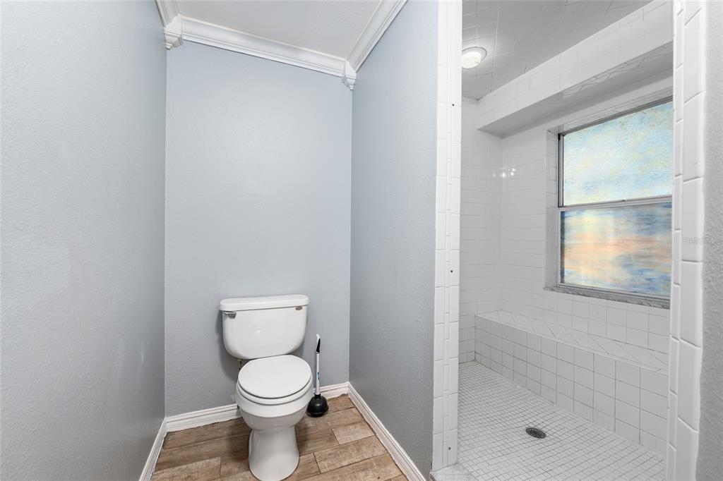 9161 Southwest 34th Place Ocala, FL 34481 - Photo 29 of 100 a bathroom with a toilet and a shower