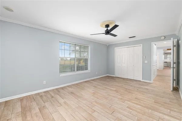 a kitchen with stainless steel appliances kitchen island granite countertop a refrigerator and a stove top oven