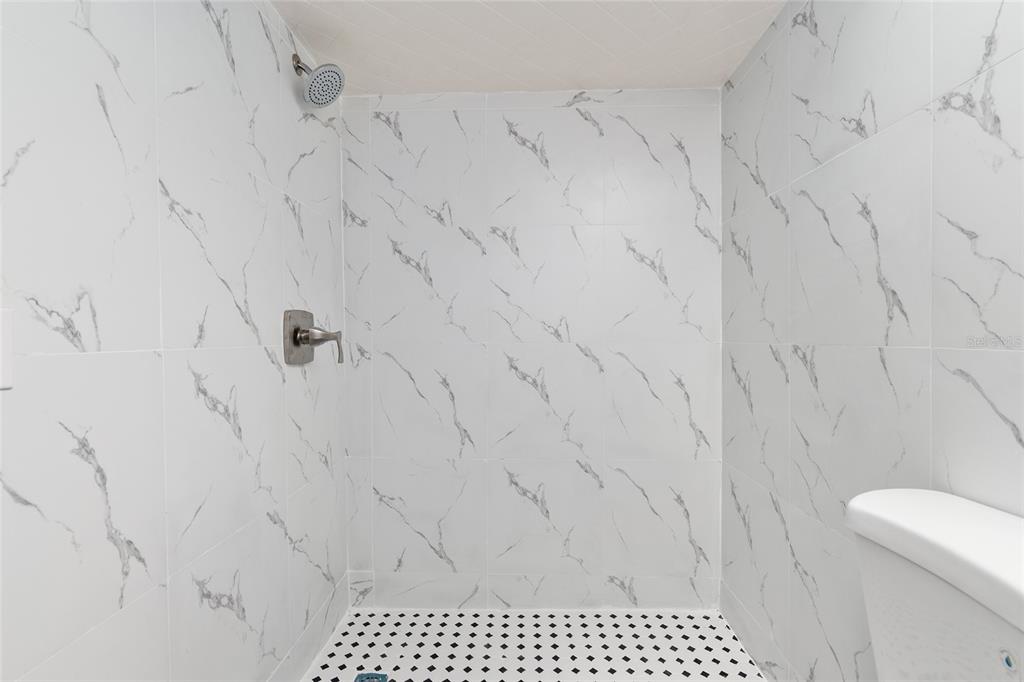 9161 Southwest 34th Place Ocala, FL 34481 - Photo 35 of 100 a bathroom with a shower