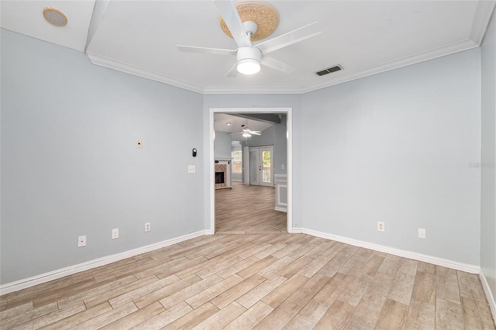 9161 Southwest 34th Place Ocala, FL 34481 - Photo 37 of 100 wooden floor in an empty room with a window
