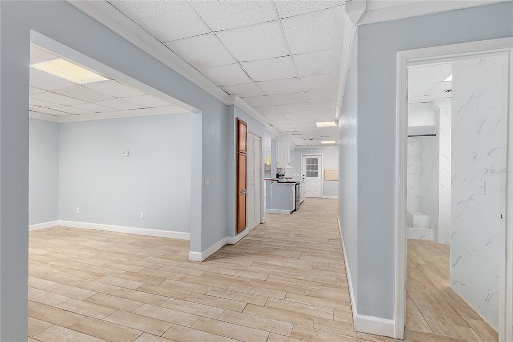 9161 Southwest 34th Place Ocala, FL 34481 - Photo 42 of 100 a view of a hallway with wooden floor