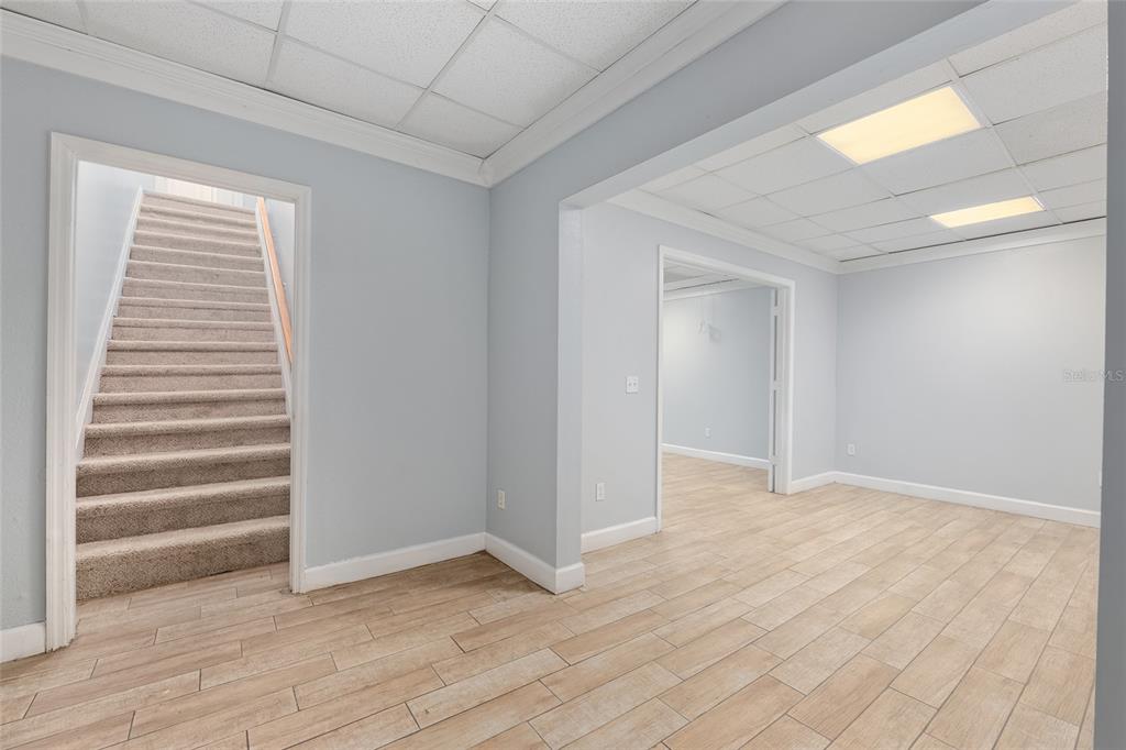 9161 Southwest 34th Place Ocala, FL 34481 - Photo 43 of 100 a view of an empty room with wooden floor and a window