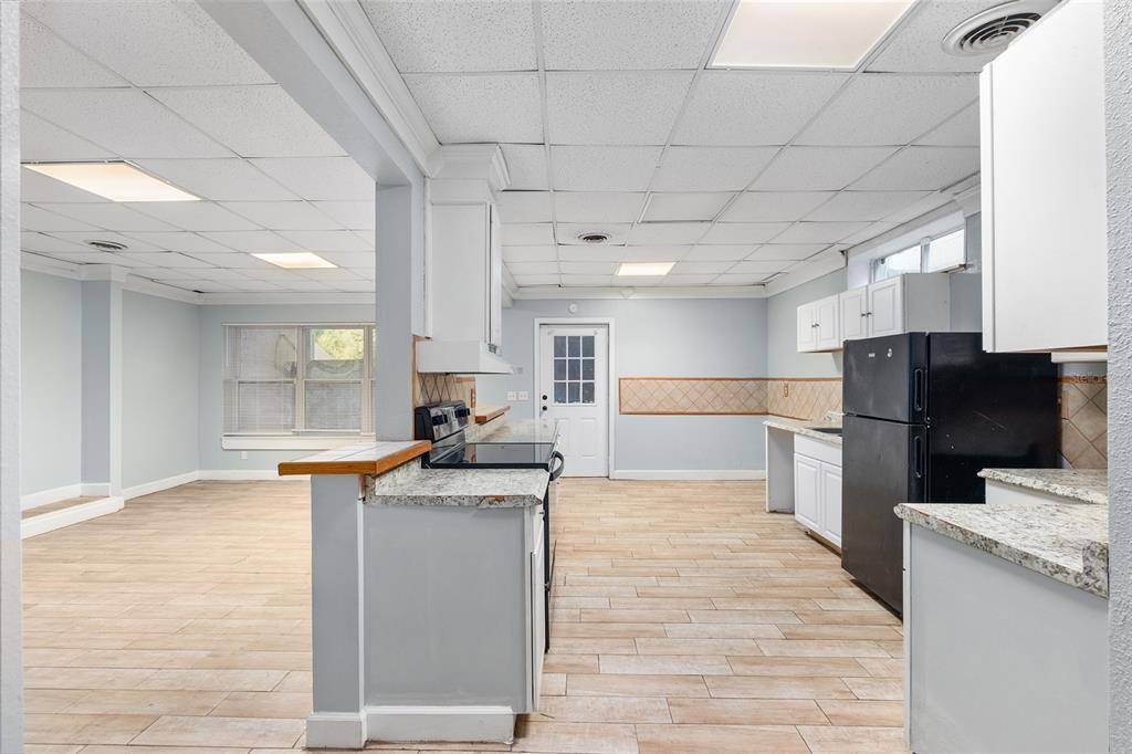 9161 Southwest 34th Place Ocala, FL 34481 - Photo 55 of 100 a kitchen with stainless steel appliances kitchen island granite countertop a refrigerator and a stove top oven