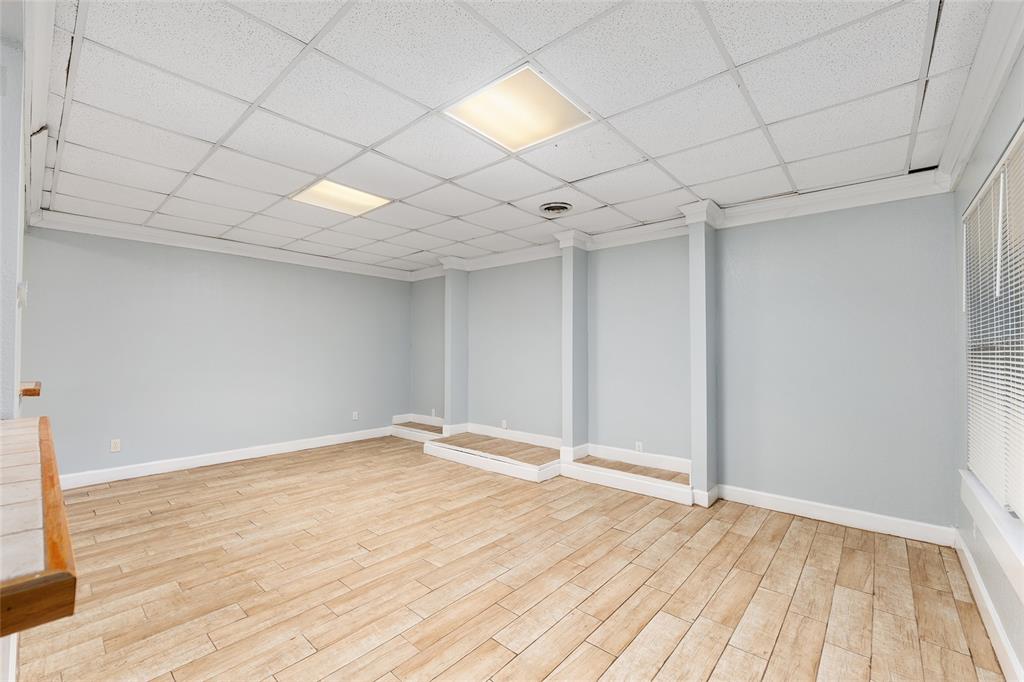 9161 Southwest 34th Place Ocala, FL 34481 - Photo 59 of 100 an empty room with wooden floor and windows