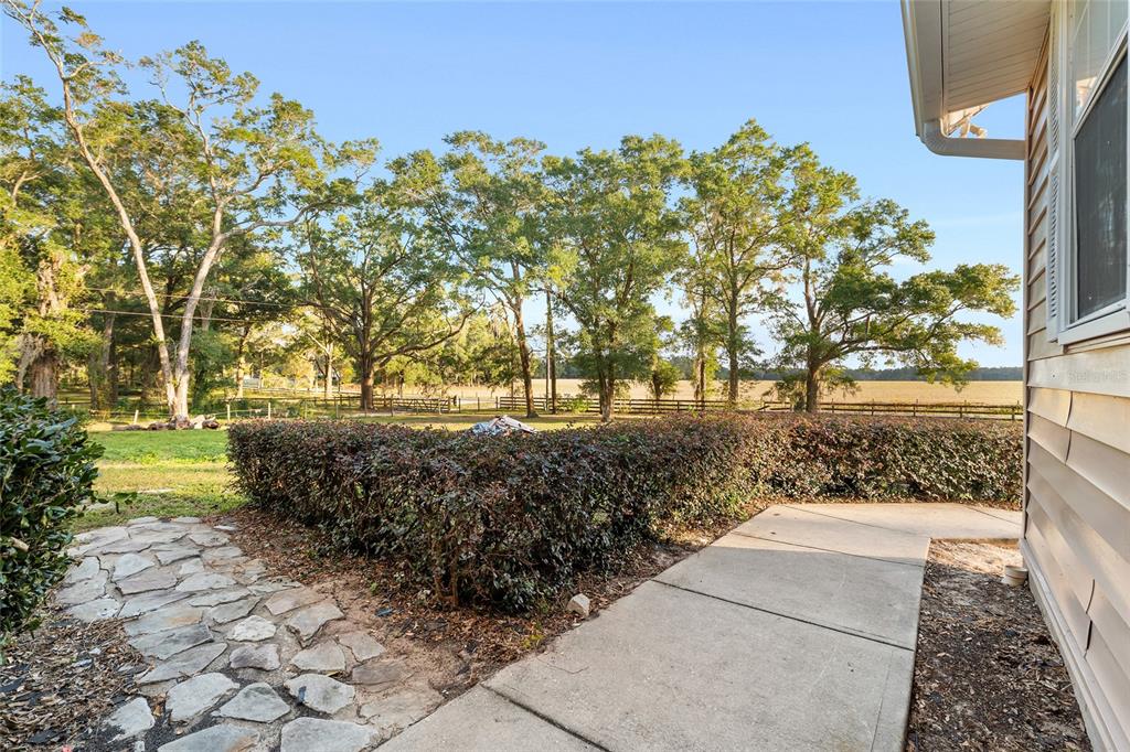 9161 Southwest 34th Place Ocala, FL 34481 - Photo 7 of 100 a view of a pathway with a yard