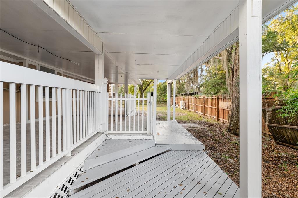 9161 Southwest 34th Place Ocala, FL 34481 - Photo 77 of 100 a view of a porch with wooden floor